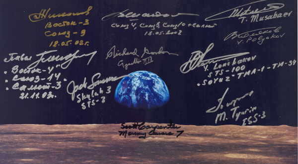 Earth rise, signed by seven Cosmonauts and three Astronauts